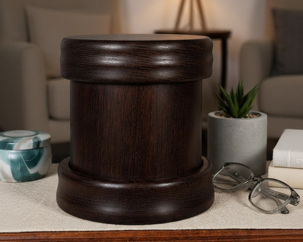 A wenge and rosewood pet urn styled on a table with soft, comforting home accents.